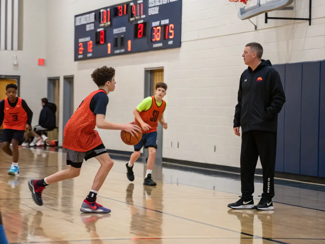 Teenagers, aged 14-16, engaged in a competitive basketball scrimmage, showcasing their skills in shooting, passing, and teamwork. The setting is an outdoor basketball court with spectators cheering from the sidelines.